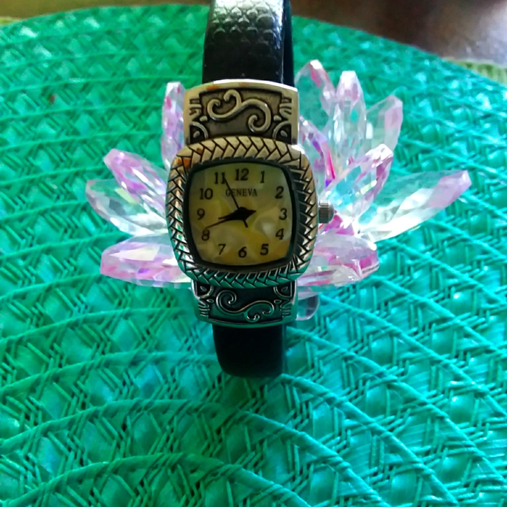 GENEVA wrist watch. Bracelet style with black leather band.